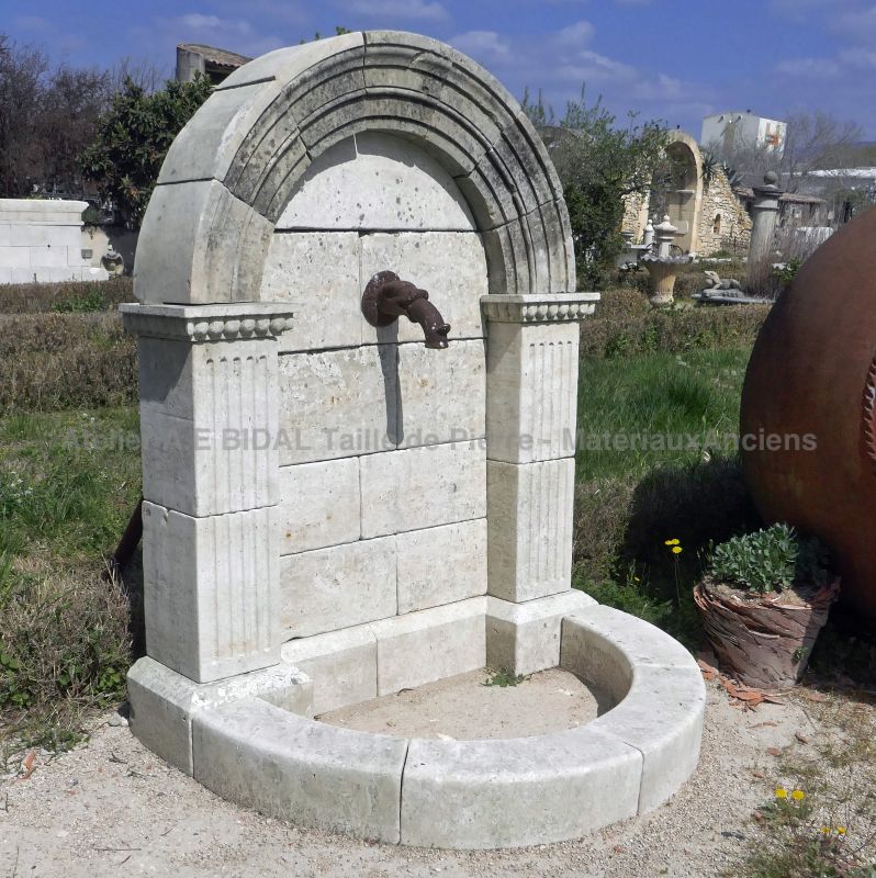 Aged and patinated stone garden fountain : an original and unique wall fountain by Atelier Alain BIDAL, Provence