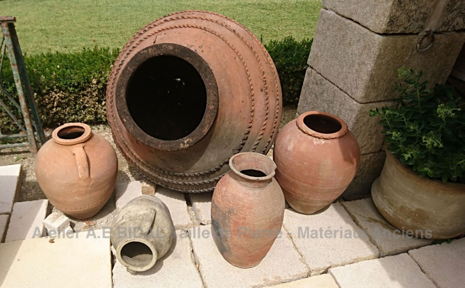 Here is a magnificent ancient terra cotta jar offered by The Atelier Bidal in Provence.