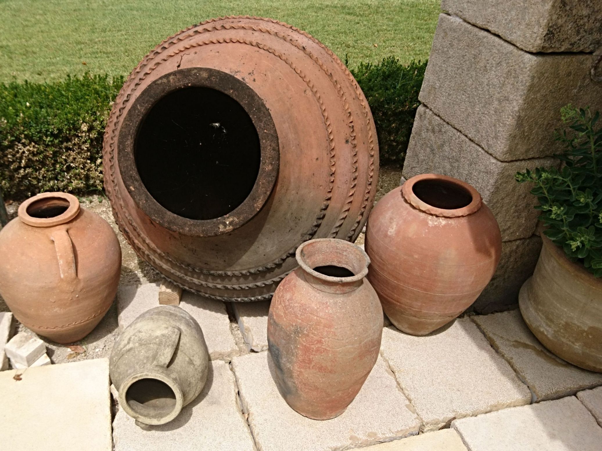 Here is a magnificent ancient terra cotta jar offered by The Atelier Bidal in Provence.
