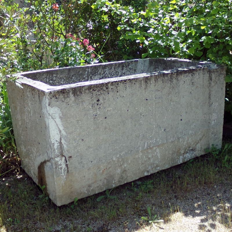 Large solid trough made of natural white stone with beautiful natural patina