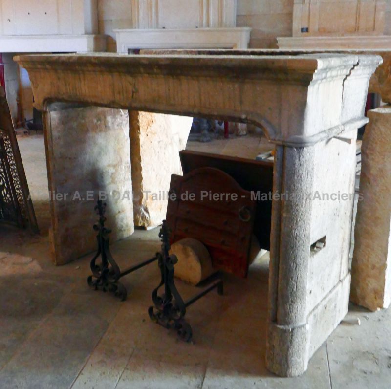 Large 19th Century fireplace in weathered stone : The Antique Materials in Provence Alain BIDAL