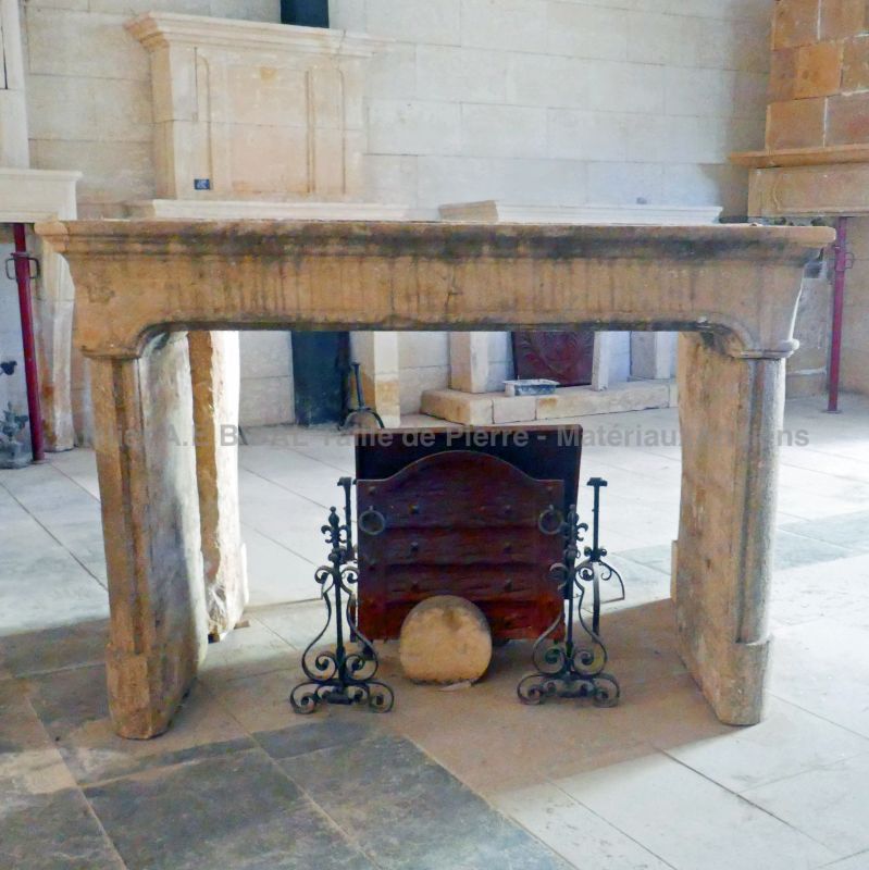 19th century fireplace in stone : a large antique stone mantel by Alain Bidal Antique Materials in Provence