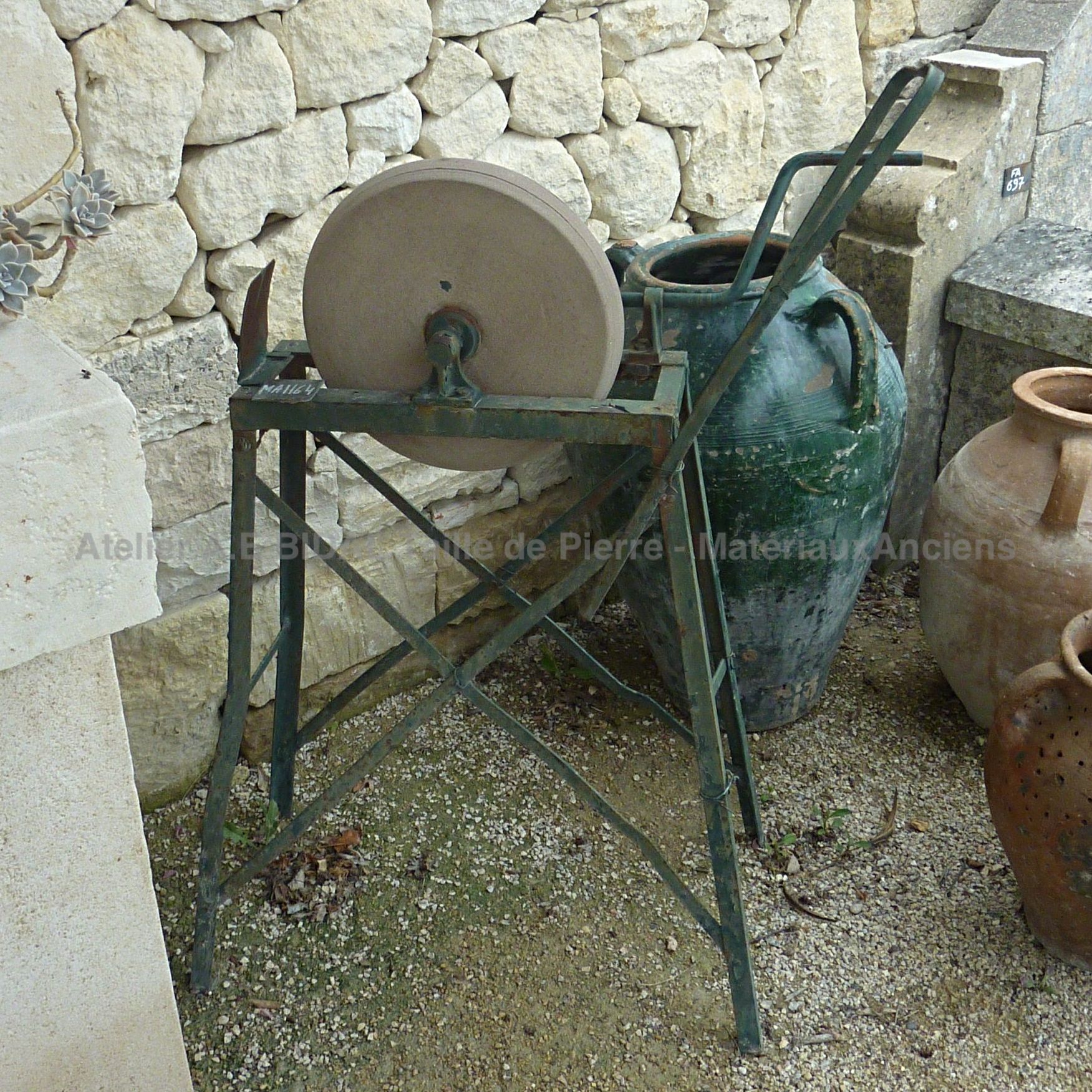 Old millstone, ideal to sharpen your blades, knives or other tools.