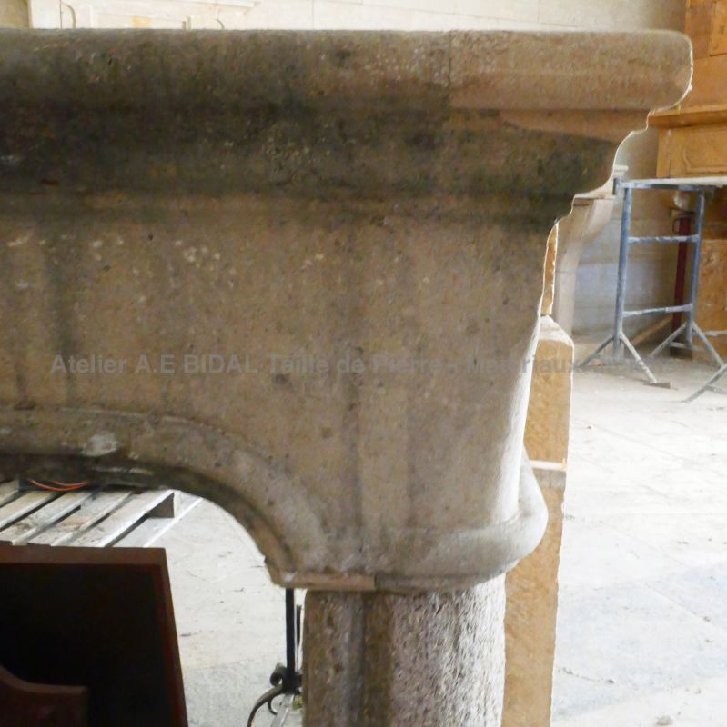 Large 19th century fireplace in weathered limestone : Atelier Alain BIDAL (Provence)